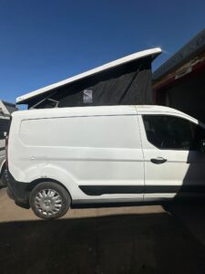 Ford Transit Connect pop top roof supplied and fitted by Pop Top Nation with black canvas and white roof shell