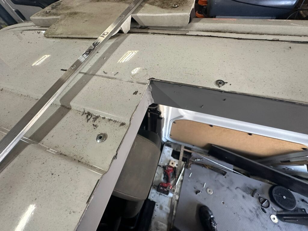 Precision roof aperture cut during Ford Transit Connect pop top roof installation
